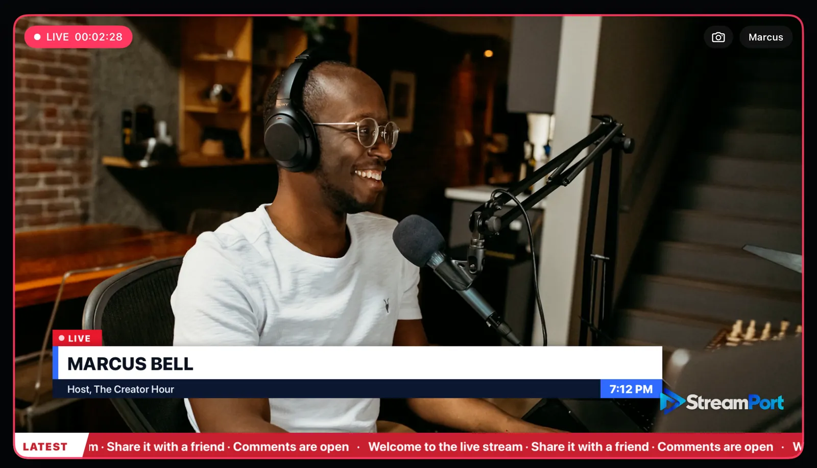A podcast host on air with a news-style lower third showing his name, a clock and a scrolling ticker