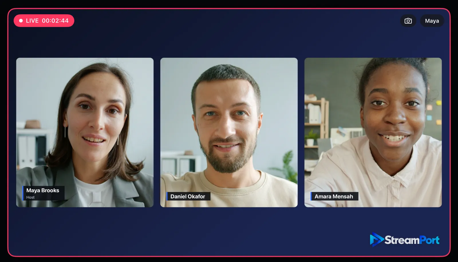 A host and two guests side by side on air, each with a lower third showing their own name
